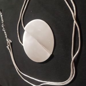 Reversable circle pendant necklace 30+2inches long in silver tone.
